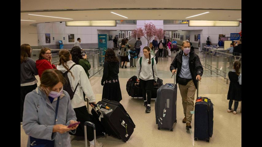 Some visitors report extra scrutiny at US airports as Trump's new travel ban begins