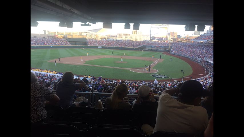 Fans linked to LSU team aid stricken man during CWS game