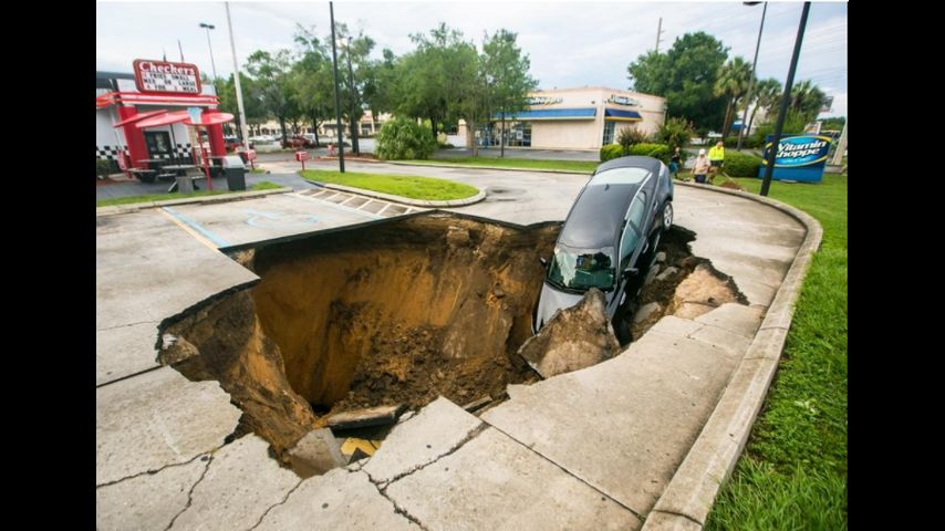 Sinkhole swallows car in Florida restaurant parking lot