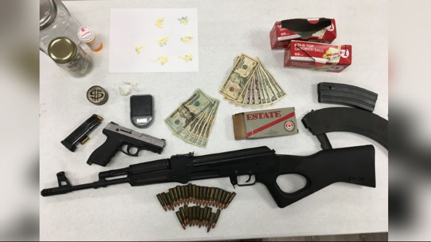 Denham Springs officers searching for man after several drugs, guns seized