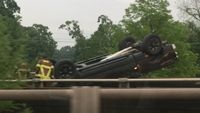 Car overturns on I-10, lands on exit ramp near downtown Baton Rouge