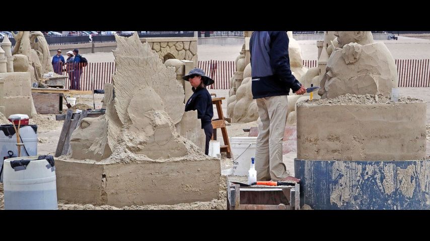 Artists turn a pile of sand into a thing of beauty
