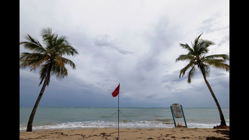 Hurricane Erin weakens to Category 3 as forecasters wait for northward turn