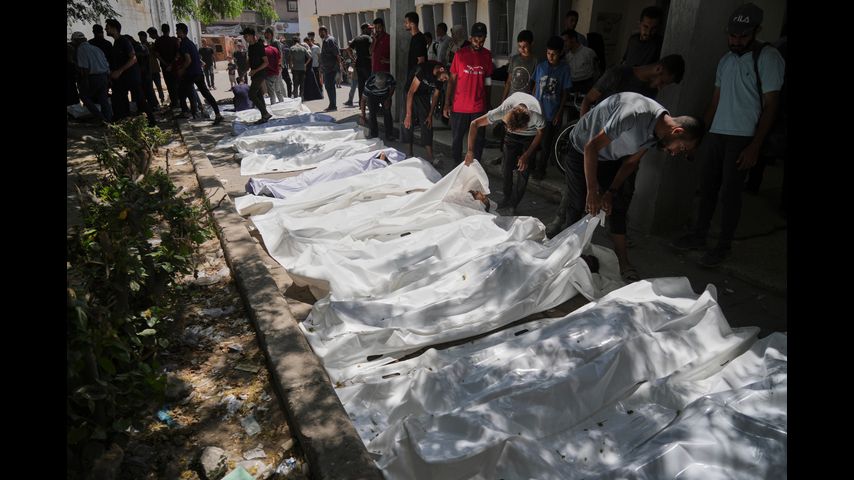 Officials say 85 Palestinians seeking aid are killed in Gaza as Israel widens evacuation orders