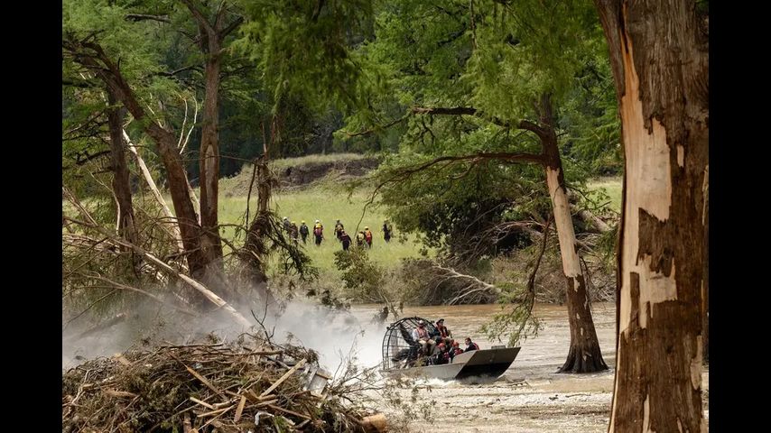 Search for flood victims slowed by mountains of debris as thousands descend on Kerr County to assist
