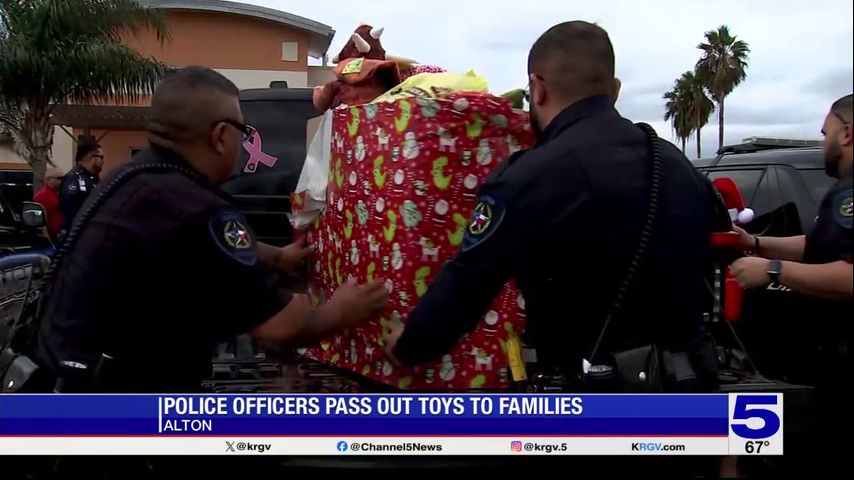 Alton police officers distribute toys to families for Christmas