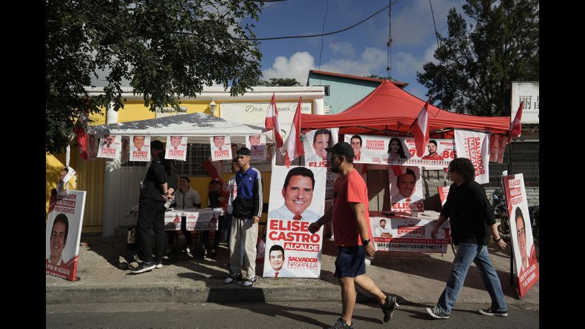 Hondurans vote to elect new president in a close race under shadow of Trump's surprise intervention
