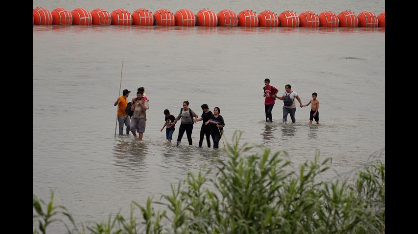 Biden administration sues Texas governor over Rio Grande buoy barrier that's meant to stop migrants