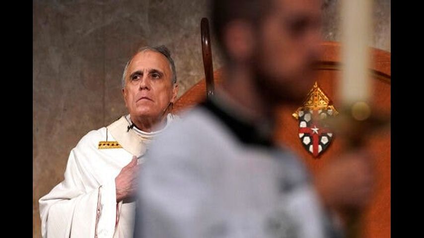 Allegations against top priest under review after AP report