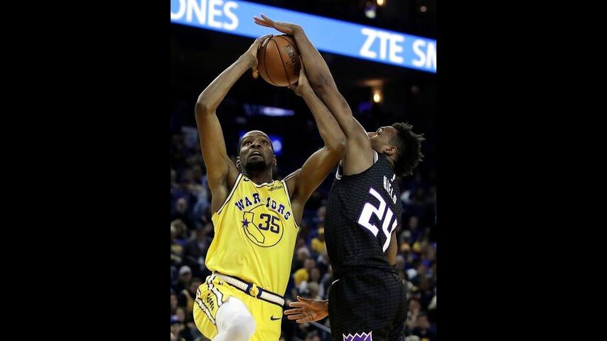 Curry scores 36 as Warriors hold off Kings 125-123