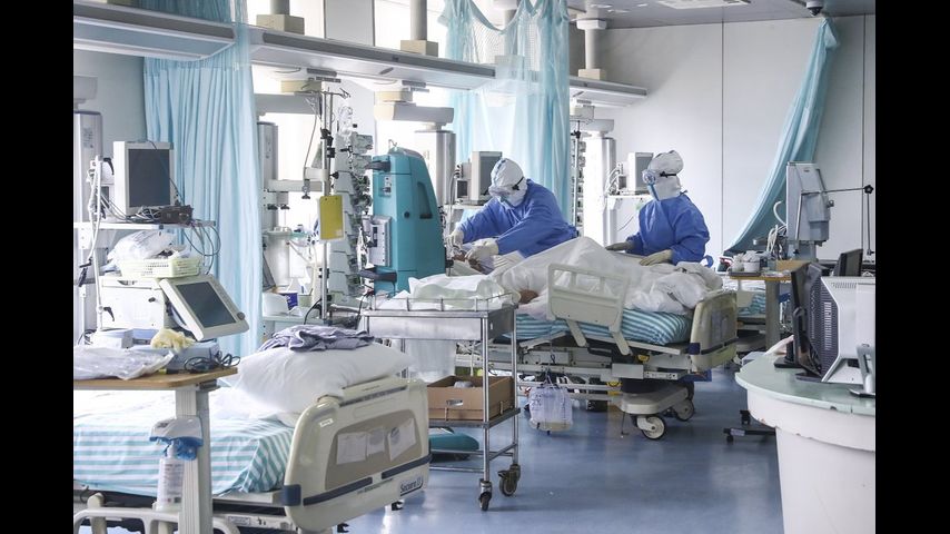 China reports major drop in new virus cases; 143 new deaths