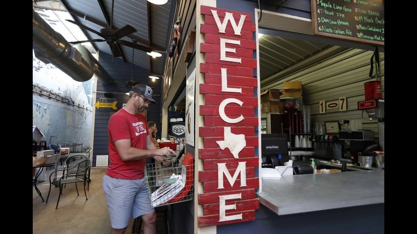 As daily virus deaths spike, Texas reopens door for business