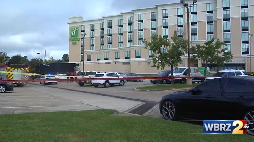 One found dead in Holiday Inn parking lot following double-shooting