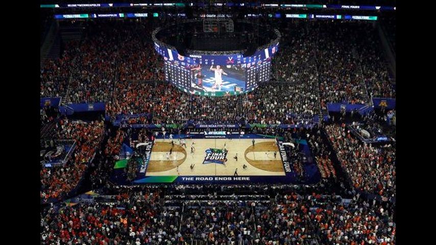 NCAA Latest: Virginia's clutch tourney goes down in history