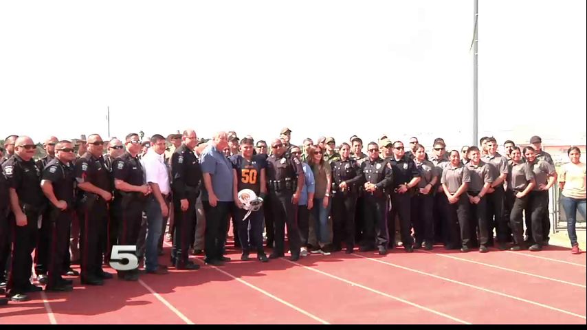 Community Gathers to Support Fallen Officer’s Son at First Football Game