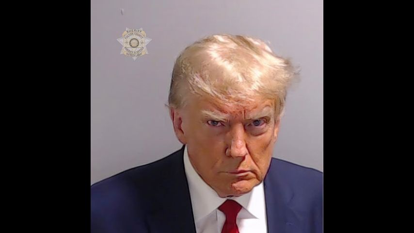 Mug shot of Donald Trump during speedy booking at Atlanta jail shows scowling former president