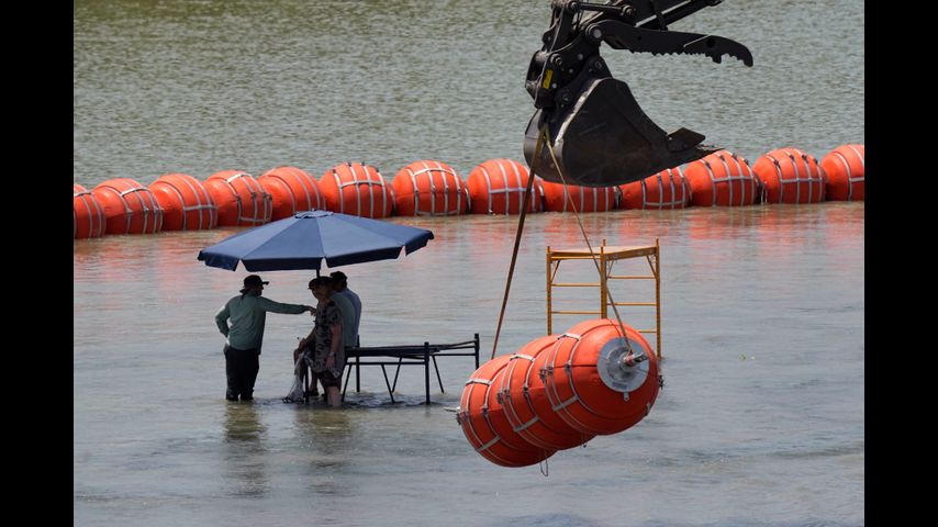 Justice Department tells Texas that floating barrier on Rio Grande raises humanitarian concerns