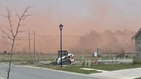 Sprinklers not working properly at closed plant, causing red dust to fly