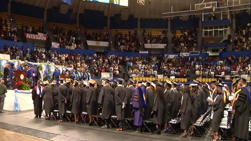 College students don their caps and gowns for graduation