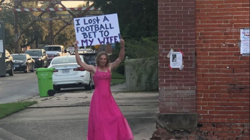 Football fan loses bet to wife, dons pink dr image