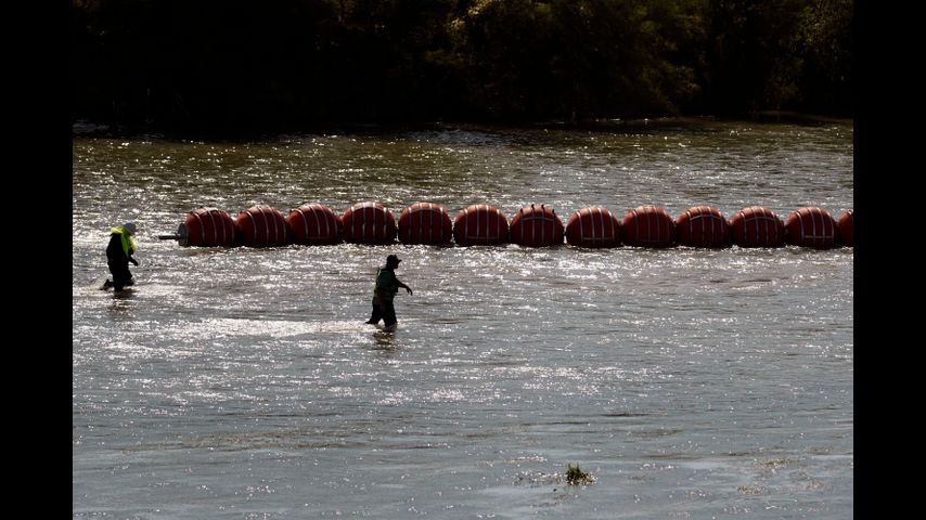 Justice Department planning legal action against Texas over floating border barrier