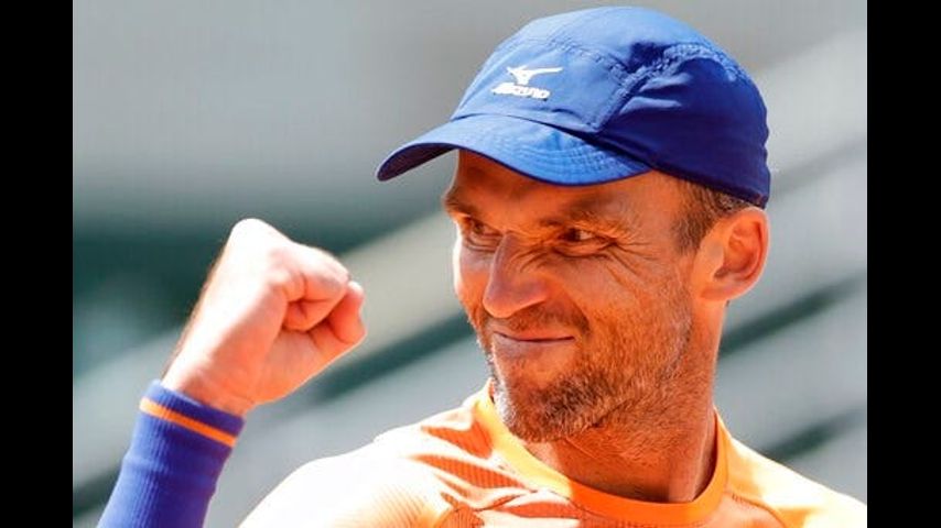 Old timer's day: Karlovic, Bryan bros. in wins for the ages