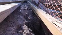 Concrete-lined canal causes large sinkhole, homeowner waiting for repairs