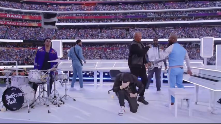 At Super Bowl halftime, Eminem takes a knee, 50 Cent hangs upside