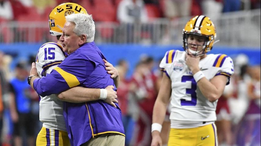 LSU head coach Ed Orgeron punches himself in the jaw before games 