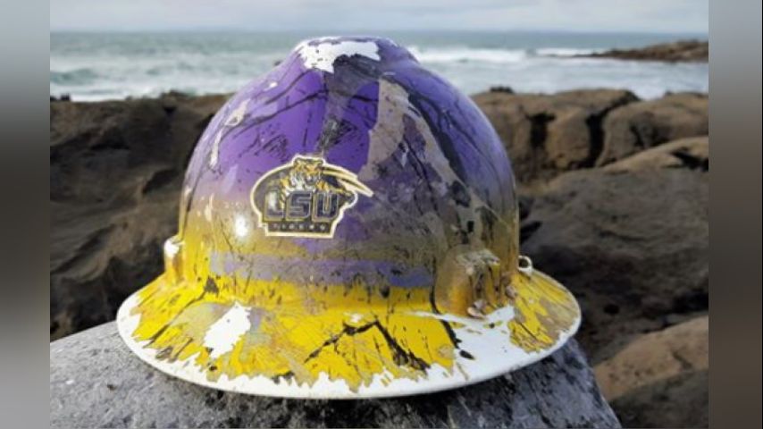 Eastland in hard hat with unidentified men in hard hats at Water