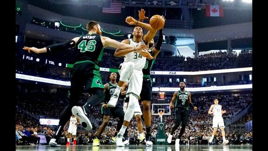 Irving, Horford lead Celtics past Bucks 112-90 in opener