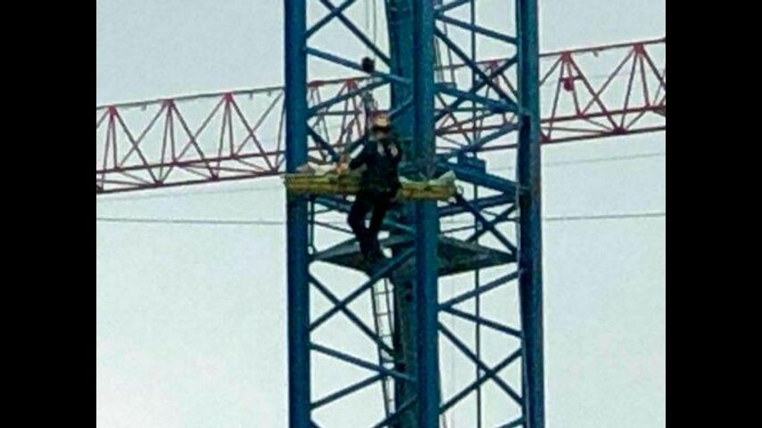 Crane operator's arm nearly severed in accident 300 feet up